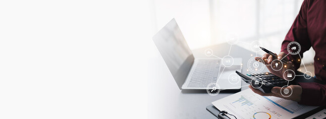 Businessman computing historic data to predict stock market behaviour. Internet trading concept. Forex and financial hologram chart over the desk and calculator. Stock market crash.