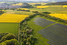 Aerial View Of Flowering Rapeseed Fields And Solar Panels In The Taunus Near Taunusstein - Germany Near Wiesbaden