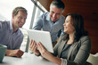 © Grady Reese/peopleimages.com - Business people, tablet and happy planning, meeting or collaboration of results, website sales and investment profit. Professional woman, men or accountant boss reading information on digital tech