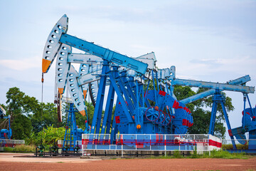 Wall Mural - In the field country crude oil industry the oil rig pump in the evening of the pumping