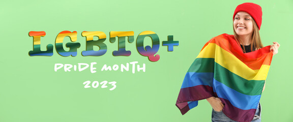 Poster - Beautiful young woman with LGBT flag on green background. Happy Pride Month