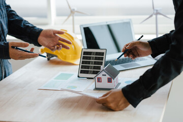 engineer and contractor planning to install solar panel on building rooftop