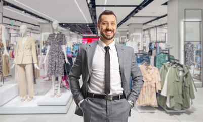 Poster - Young professional man standing in a clothing store