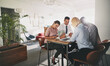 © Flamingo Images - Diverse businesspeople working at a table