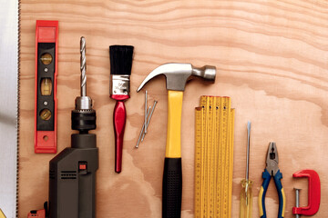 Wall Mural - Assorted work tools on wood