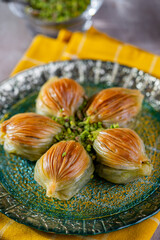 Wall Mural - Traditional turkish baklava pistachio pastry. Dilberdudagi, ozel kesim baklava, cikolatali baklava, fistikli baklava. 
