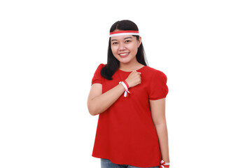 Young Indonesian girl celebrate indonesia independence day with hand on the chest