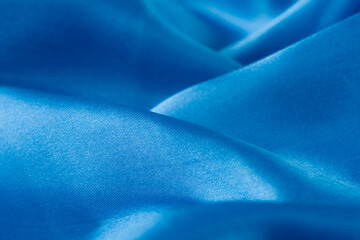 Wall Mural - Abstract blue silk fabric texture background. Creases of satin	
