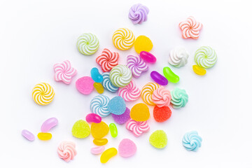 Sweet lollipops and candies on white background