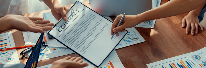 Poster - Panorama shot hand signing signature on legal contract, business report and BI Fintech paper on table. Seal business agreement deal with signature. Investment loan for startup company. Scrutinize