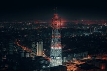 Nighttime Mobile Signal Tower For 4G And 5G Data With City Background. Generative AI
