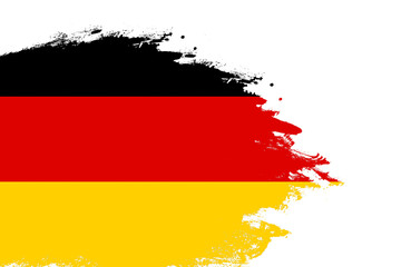 Wall Mural - Germany flag on a stained stroke brush painted isolated white background with copy space