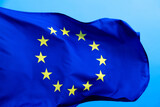 Fototapeta  - European Union Flag waving on blue background