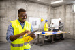 © littlewolf1989 - Civil engineer working on digital tablet at construction site.