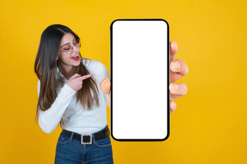 holding big blank cell phone, cheerful caucasian woman holding big blank cell phone. millennial lady