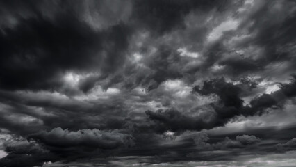 dark dramatic sky with black stormy clouds before rain or snow as abstract background, extreme weath