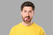 © New Africa - Man showing his tongue on gray background