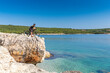 Croatia, Istria, Liznjan, mountainbiker rides along the coast