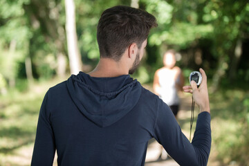 female athlete doing sports with personal trainer