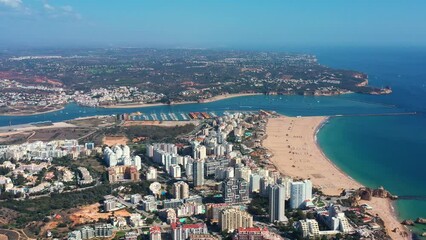 Wall Mural - Tourist Portuguese city of Portimao aerial view on a sunny day. South Portugal Algarve.