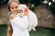 © Petro - Cute girl hugging her maltipa dog