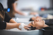 © chokniti - client woman clean washing a hair in salon, professional hairdresser washing haircut customer hair with water and shampoo treatment, coiffure beauty head hair care, fashion service