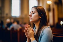 Young Woman Praying To God In Church. Faith In Religion And Belief In God. Power Of Hope Or Love And Devotion.