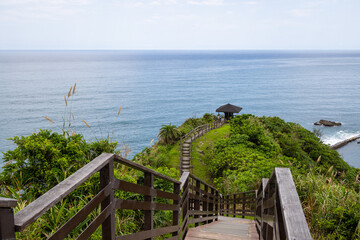 Wall Mural - wooden step hiking trail over the mountain with the sea view