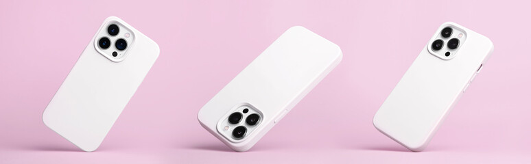 set of three iPhone 13 Pro and 14 in white silicone case falling down in different angles, back view isolated on pink background, phone cover mockup