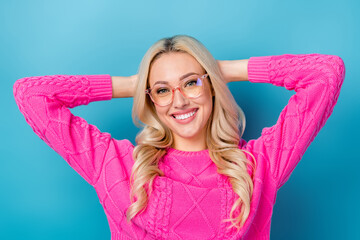 Sticker - Photo of cheerful pretty lady wear pink sweater spectacles arms behind head isolated blue color background