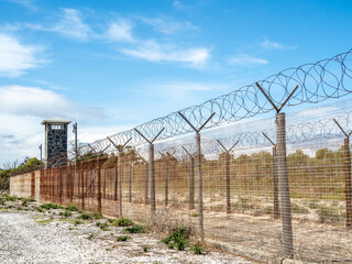 Double barbed wire fence at maximum security prison on Robben Island where Nelson Mandela and other prisoners were held.