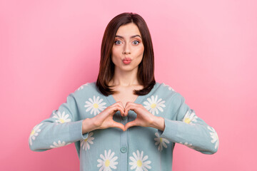 Canvas Print - Portrait of funny cute lady hold arms heart gesture sending boyfriend air kisses wear cardigan isolated pink color background