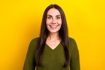 Poster - Photo of excited adorable woman dressed khaki sweater smiling big eyes isolated yellow color background