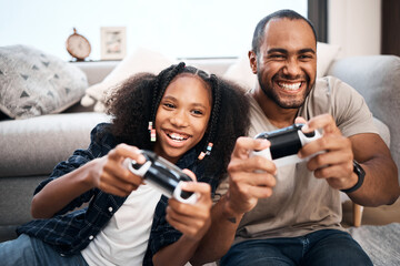 gaming, family or children with a father and daughter in the living room of their home playing a vid