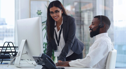 Black man, call center and woman with mentor by computer, office or learning for tech support. African male crm, female coach or teaching for telemarketing, training or customer service at help desk