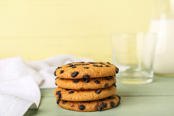 Stack of tasty cookies with chocolate chips on table