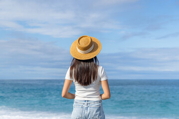 Sticker - Relaxed woman with straw hat in the beach