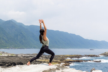 Sticker - Woman practicing yoga on the beach