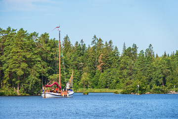 Wall Mural - Sailboat on its way into the Göta Canal in Sweden