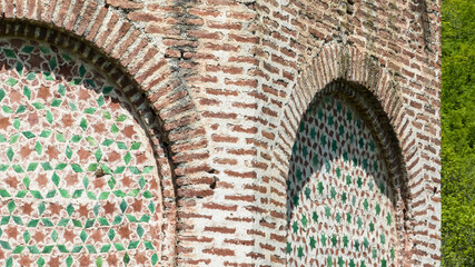 Wall Mural - fragments of decoration of an old church with ceramic tile patterns