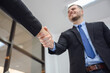 © เลิศลักษณ์ ทิพชัย - Close up of handshake in the office