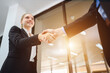 © เลิศลักษณ์ ทิพชัย - Business woman shaking hands with manager After signing contracts and in the office Handshake of successful business people