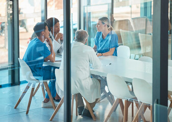 Aufkleber - Doctors, healthcare team and meeting for a discussion, planning or training at table. Diversity men and women medical group talking about communication strategy, virus or surgery in a hospital