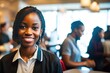 © Pictures Paradise - Portrait of smiling african american waitress in elegant restaurant looking at camera with bokeh background.