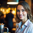 © Pictures Paradise - Portrait of smiling waitress in restaurant looking at camera with bokeh background.