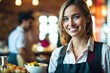 © Pictures Paradise - Portrait of smiling waitress in restaurant looking at camera with bokeh background.