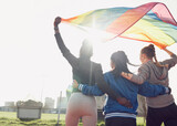 Fototapeta Sport - Fitness, rainbow flag and female athletes outdoor for pride, health and wellness achievement. Sports, love and women friends embracing while walking for political homosexual equality and lgbtq rights