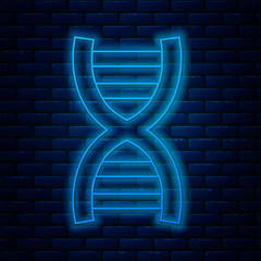 Wall Mural - Glowing neon line DNA symbol icon isolated on brick wall background. Vector