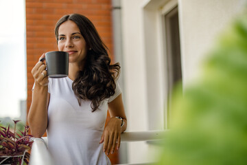 beautiful young woman relaxing over a cup of tea