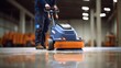 Worker polishing hard floor with high speed polishing ,machine cleaning floor with machine, floor care and cleaning service